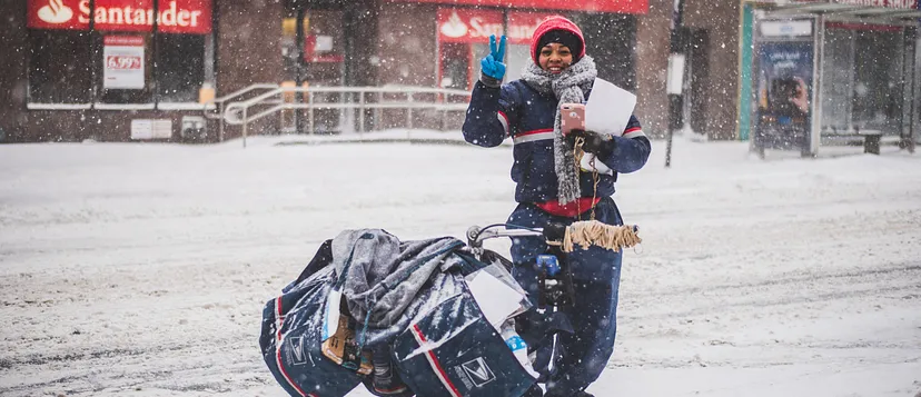 Letter carrier in the snow