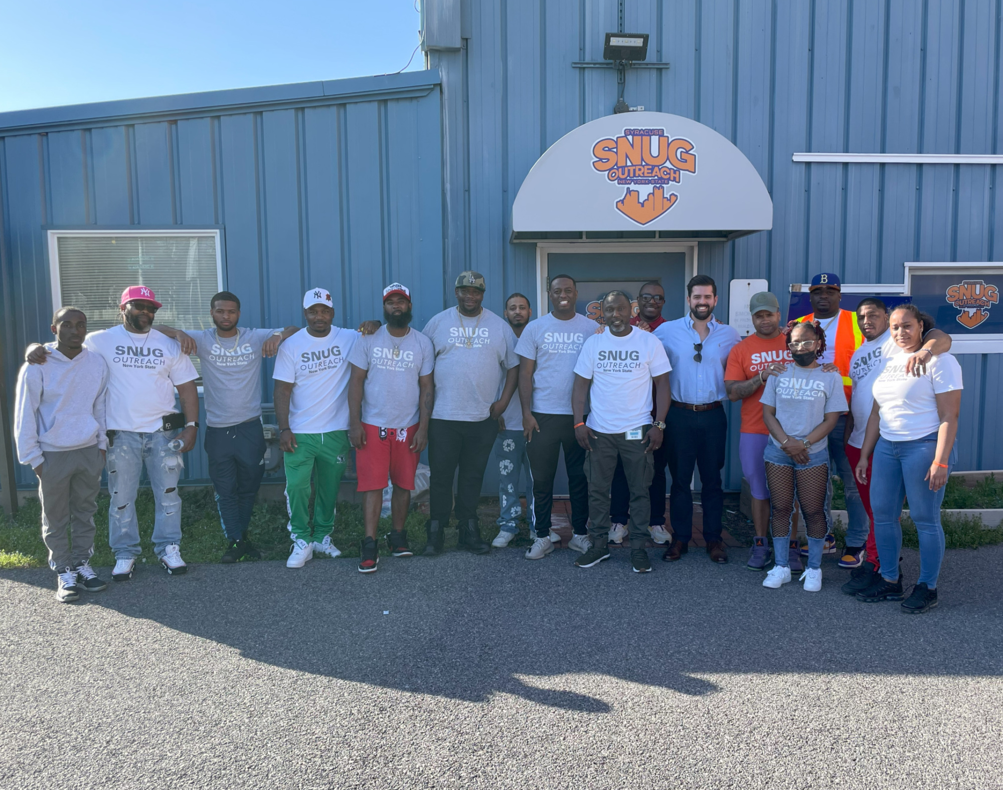 Outreach workers standing outside of their offices