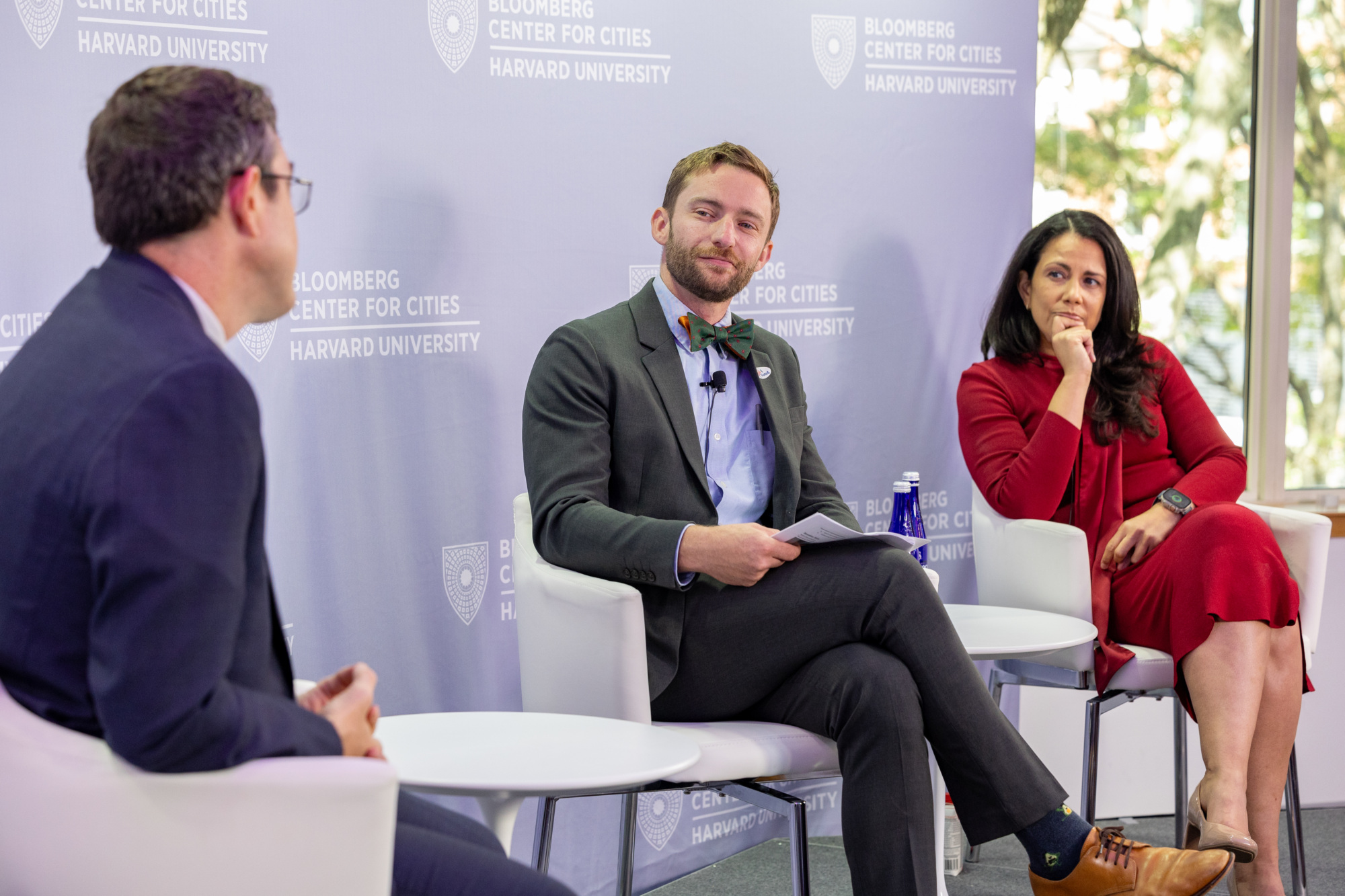 Panelists speaking on a stage