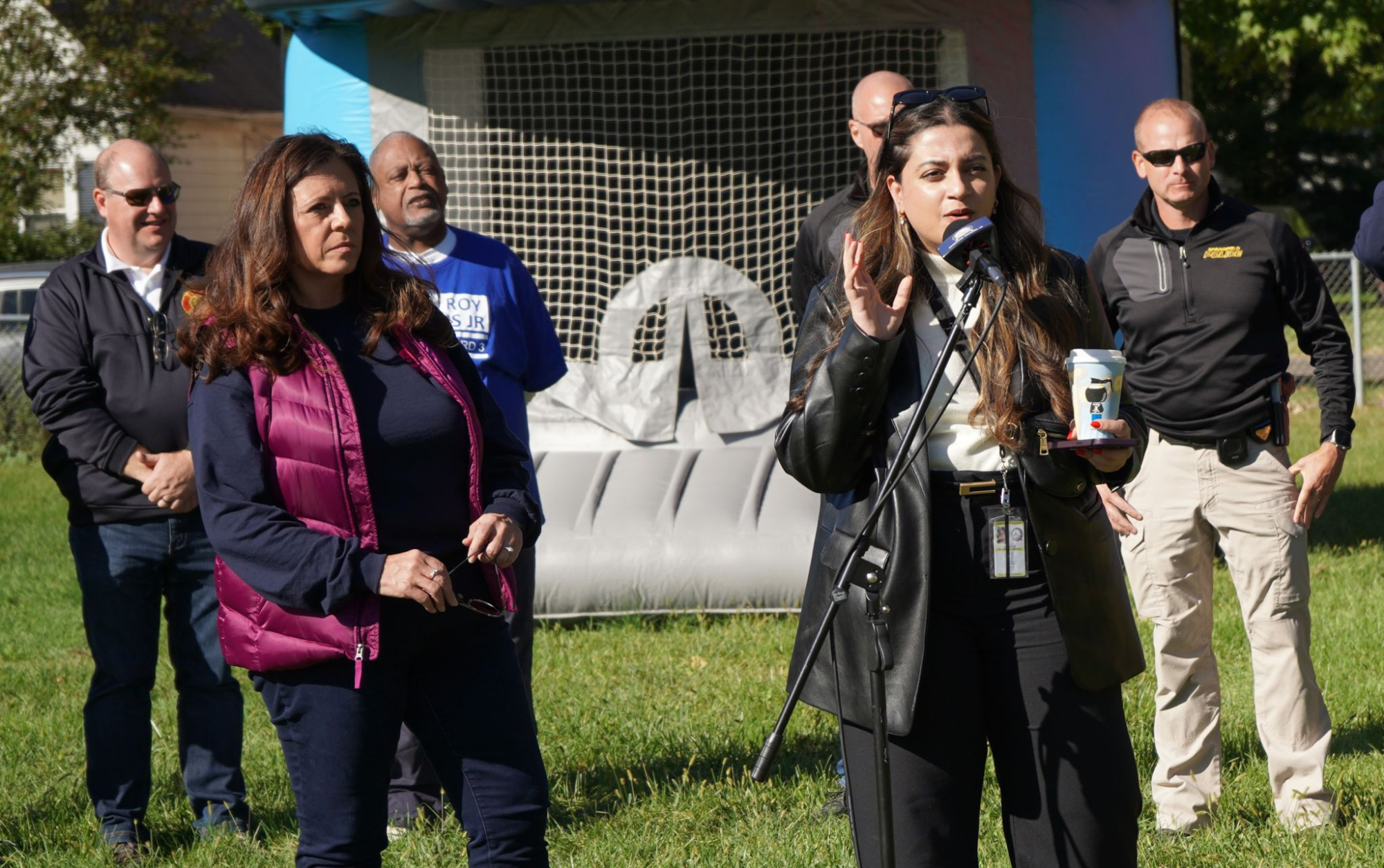 Fellow Sai Joshi speaking at a public event in Springfield, Illinois with the mayor and others in attendance