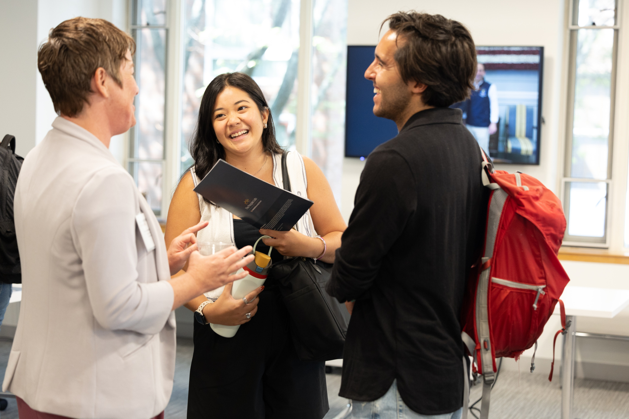 students talk with faculty