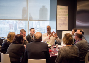 People around a table in a meeting room