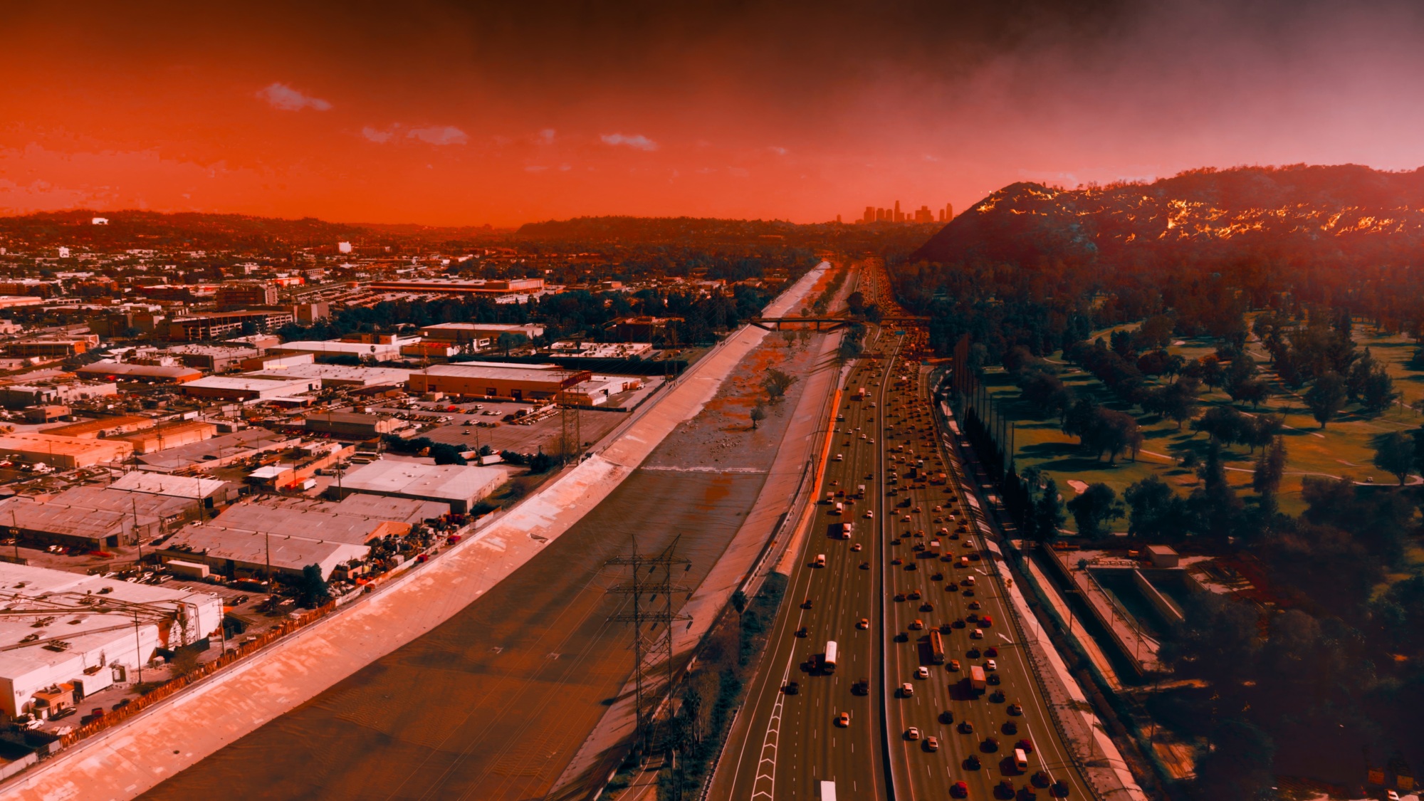 Highway with orange sky from nearby wildfire