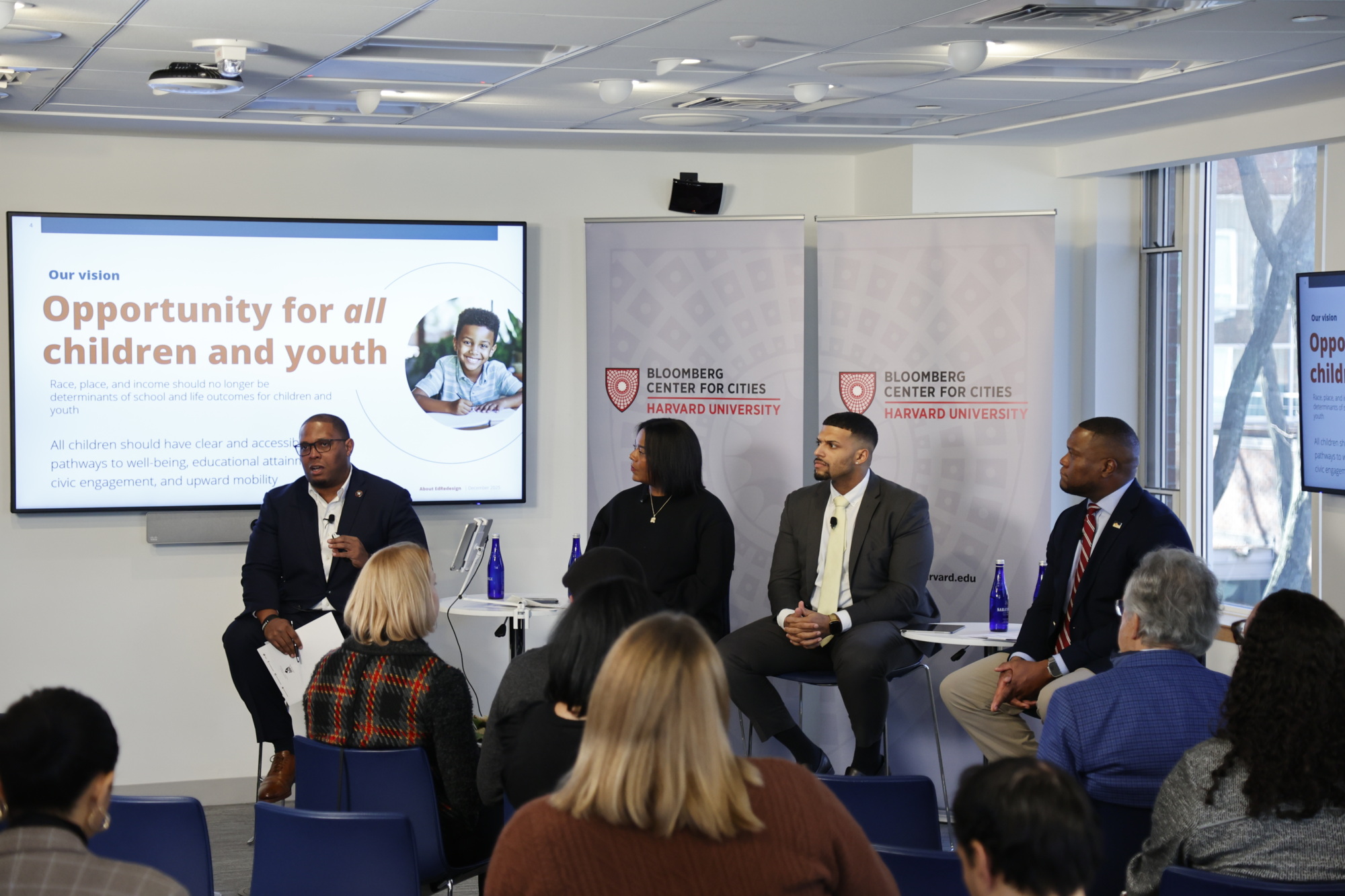 panel of people speaking to an audience