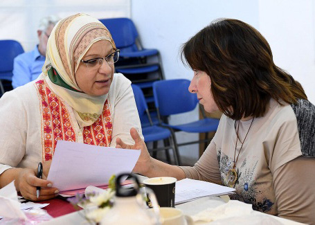 People around a table in a meeting room